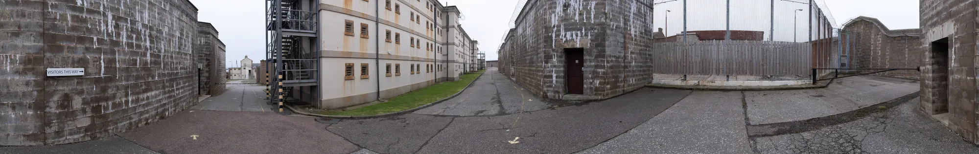 Panorama of the Peterhead Prison Museum yard with barred windows, from the hybrid virtual tour capture